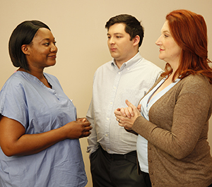 Man and woman talking to healthcare provider.